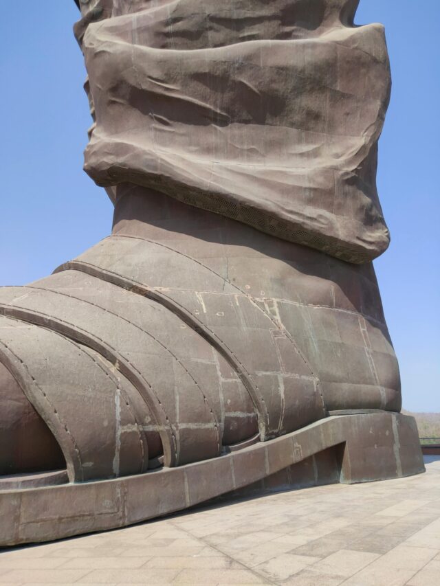Close-up of the Statue of Unity's foot in Narmada, capturing its monumental scale.