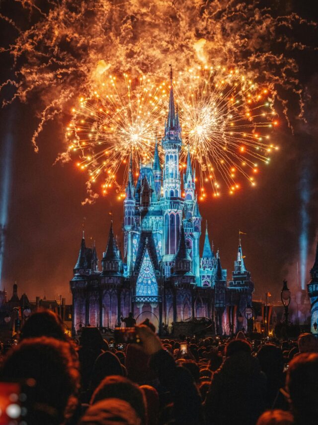 Enchanting fireworks illuminate the iconic castle at night, creating a magical celebration atmosphere.